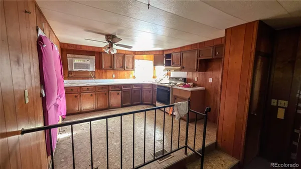 a kitchen with stainless steel appliances a refrigerator and a sink