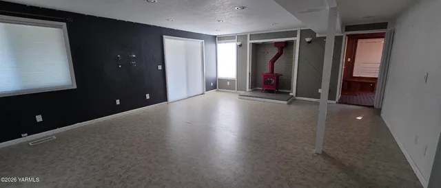 a view of sitting area with furniture and wooden floor
