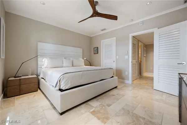 a bedroom with a bed and a walk in closet