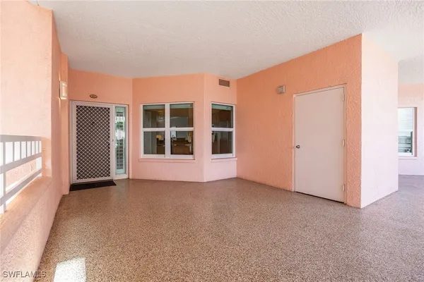 a view of empty room with windows