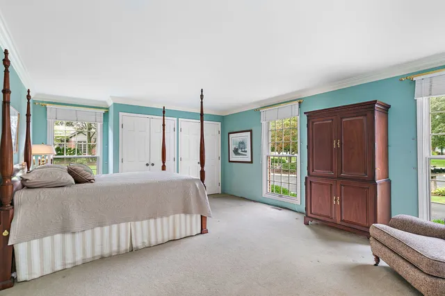 a bed room with a bed and window