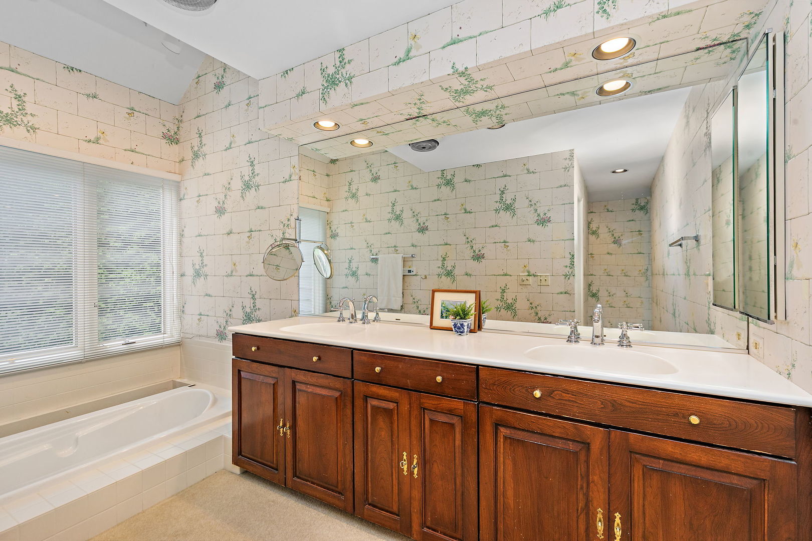 43 North Ravenscraig Lane Inverness, IL 60067 - Photo 15 of 67 a spacious bathroom with a granite countertop sink mirror and a bath tub