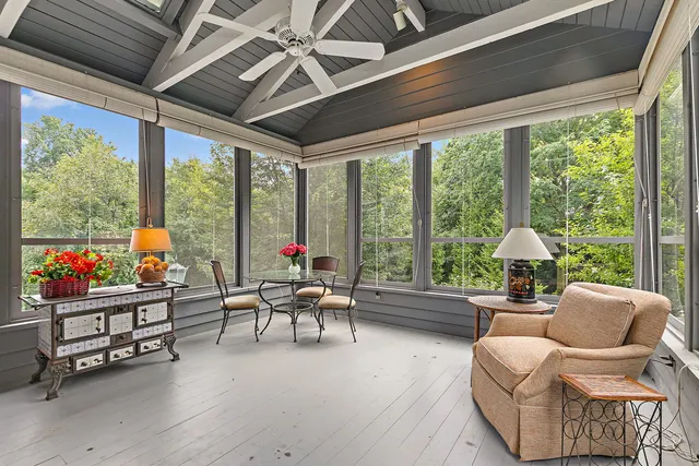 a view of an entryway with wooden floor