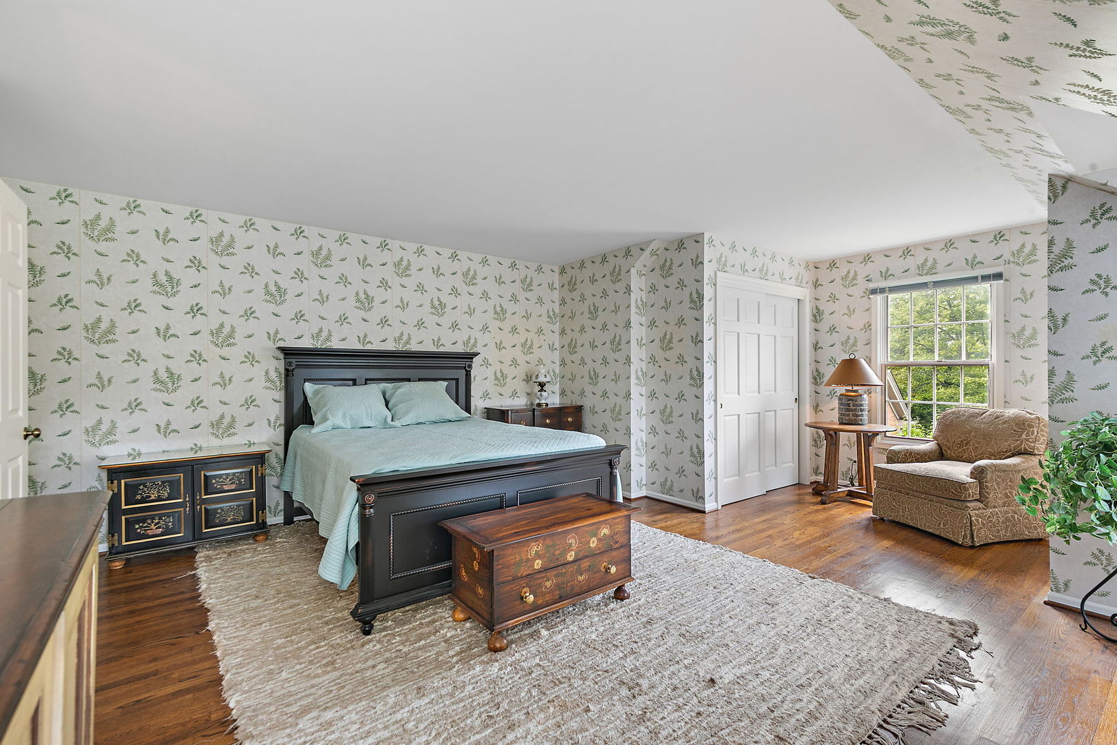 43 North Ravenscraig Lane Inverness, IL 60067 - Photo 29 of 67 a bedroom with a bed and a couch with wooden floor