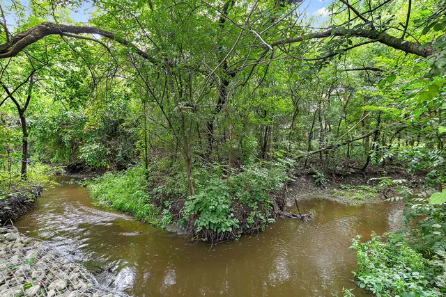 a view of a golf course with a garden