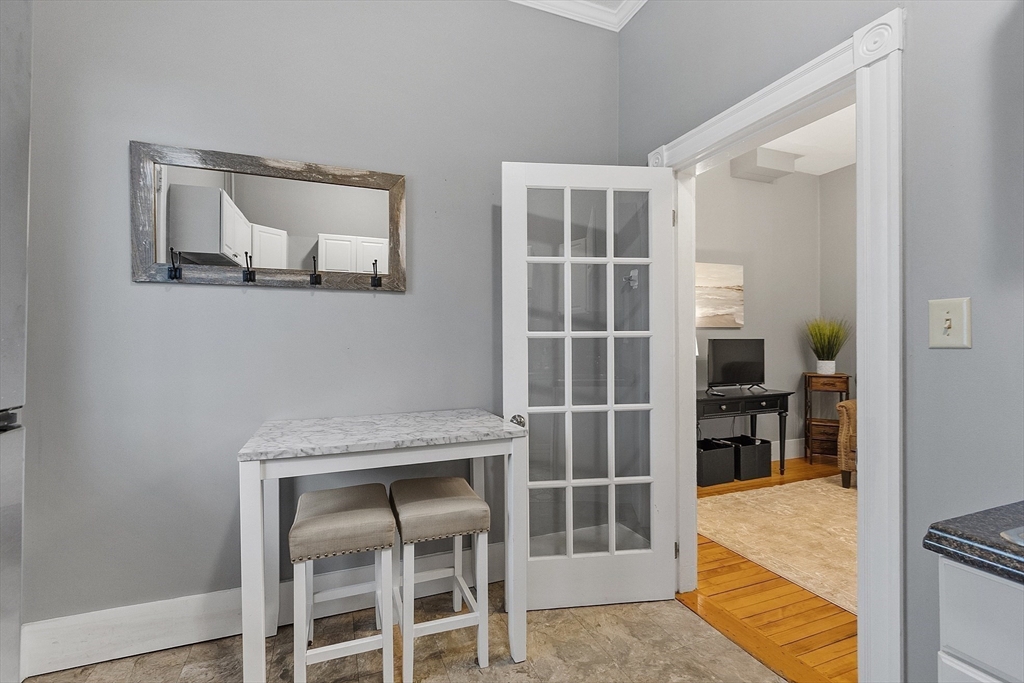 113 Main Street, Unit 3 Pepperell, MA 01463 - Photo 6 of 10 a bedroom with a bed and a window