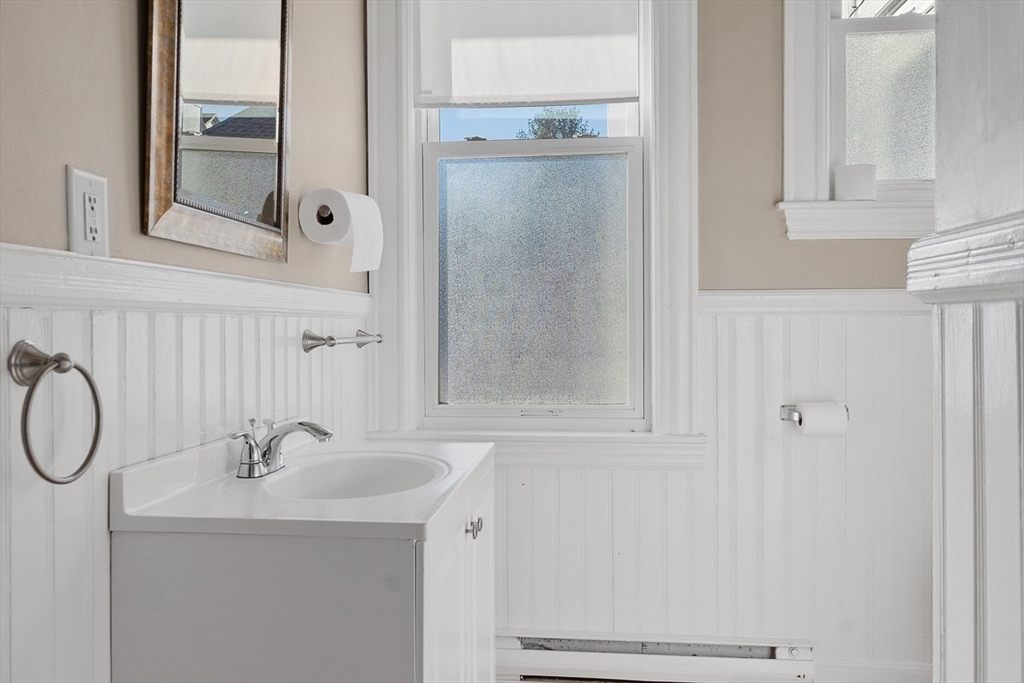 113 Main Street, Unit 3 Pepperell, MA 01463 - Photo 7 of 10 a bathroom with a sink and a mirror