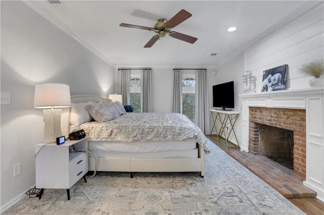 a bedroom with a bed and a fireplace