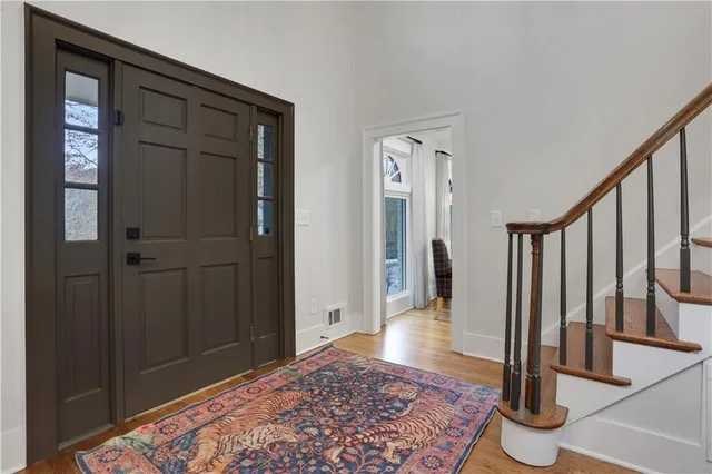 a view of entryway with wooden floor