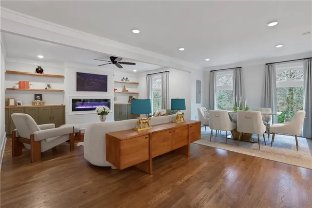 a living room with fireplace furniture and a flat screen tv