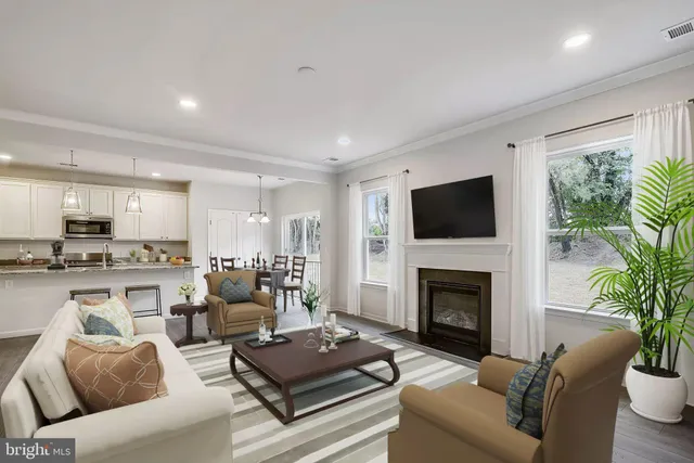 a living room with furniture fireplace and a flat screen tv