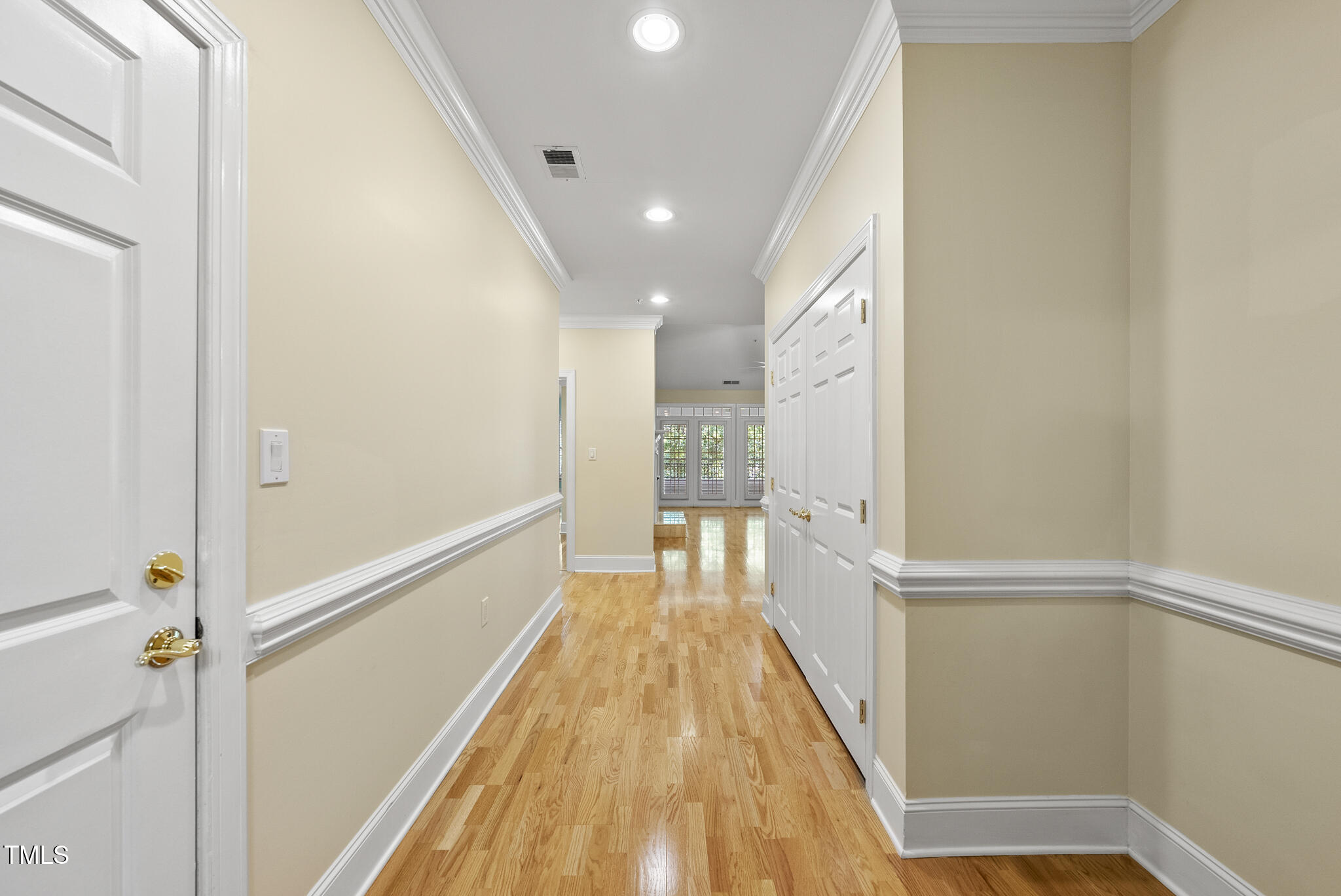 3700 Baron Cooper Pass, Unit 302 Raleigh, NC 27612 - Photo 12 of 67 a view of a hallway with wooden floor and staircase