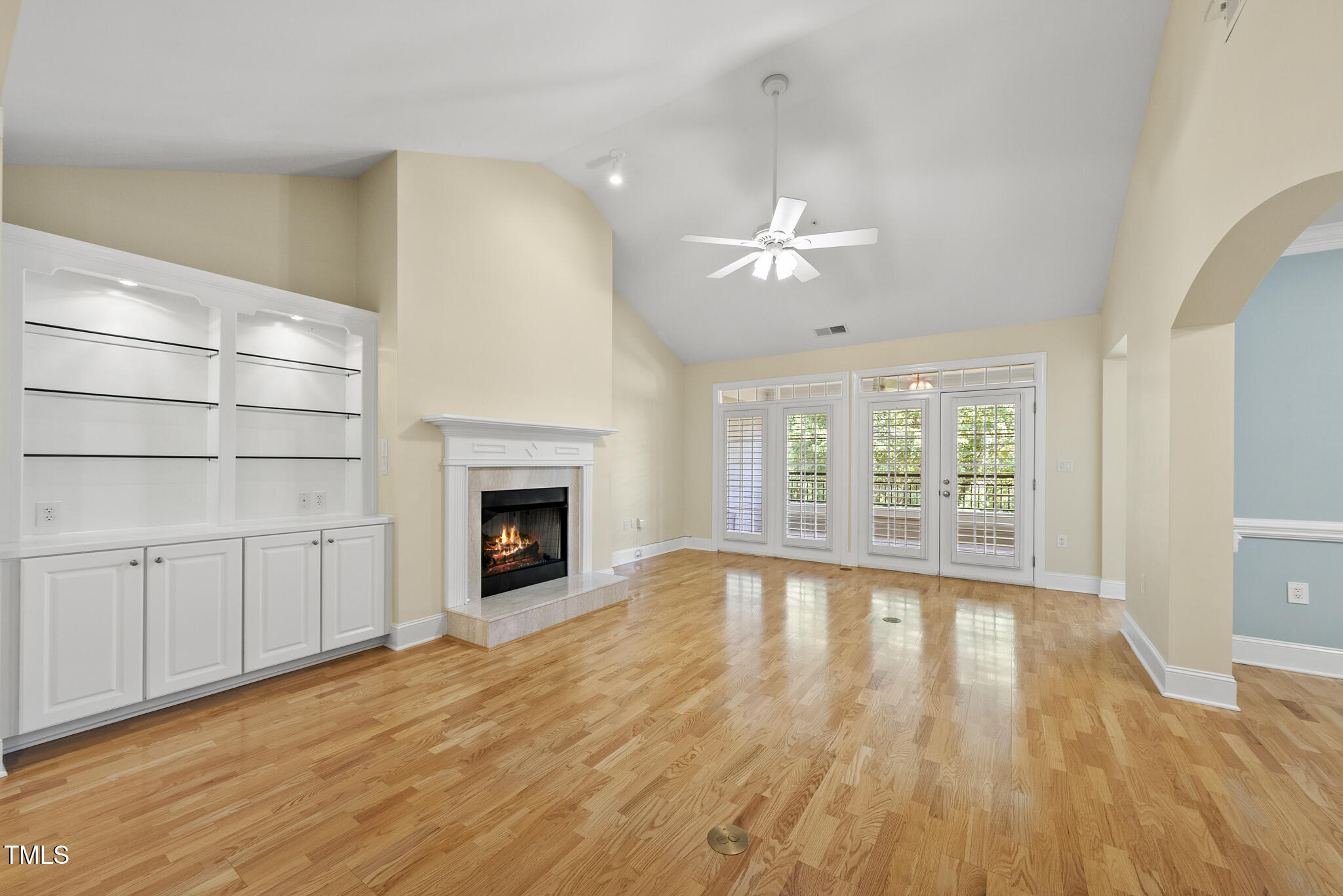 3700 Baron Cooper Pass, Unit 302 Raleigh, NC 27612 - Photo 16 of 67 a view of an empty room with a fireplace and a window
