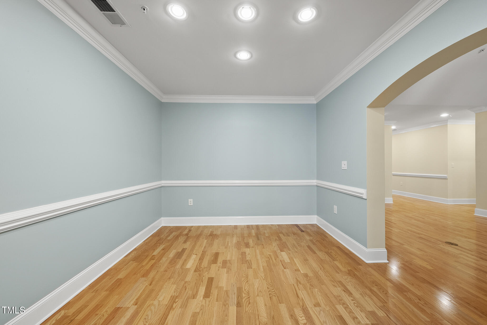 3700 Baron Cooper Pass, Unit 302 Raleigh, NC 27612 - Photo 22 of 67 a view of a room with wooden floor and white walls