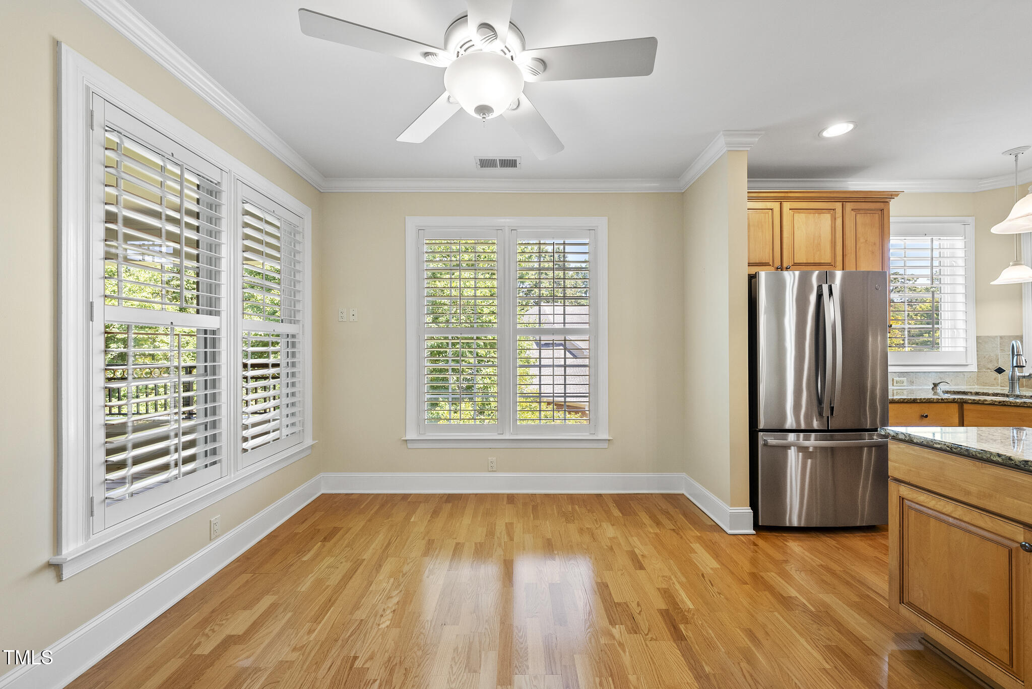 3700 Baron Cooper Pass, Unit 302 Raleigh, NC 27612 - Photo 24 of 67 a view of a kitchen with a stove fridge and wooden floor