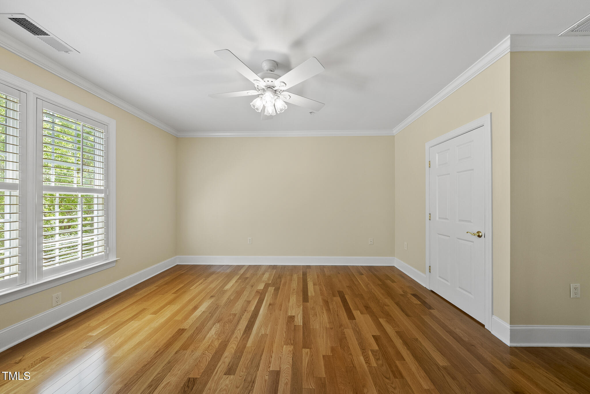 3700 Baron Cooper Pass, Unit 302 Raleigh, NC 27612 - Photo 44 of 67 a view of empty room with wooden floor and fan