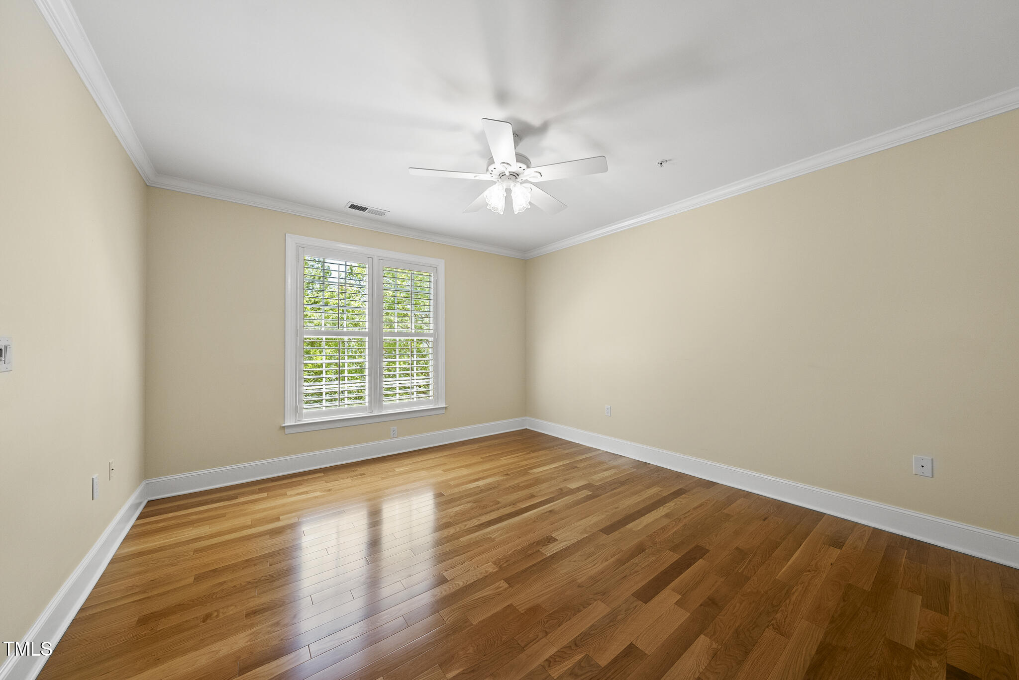 3700 Baron Cooper Pass, Unit 302 Raleigh, NC 27612 - Photo 45 of 67 wooden floor in an empty room with a window