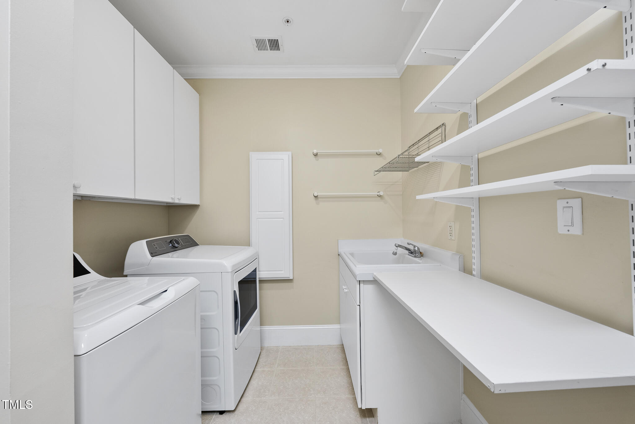 3700 Baron Cooper Pass, Unit 302 Raleigh, NC 27612 - Photo 49 of 67 a utility room with dryer and washer