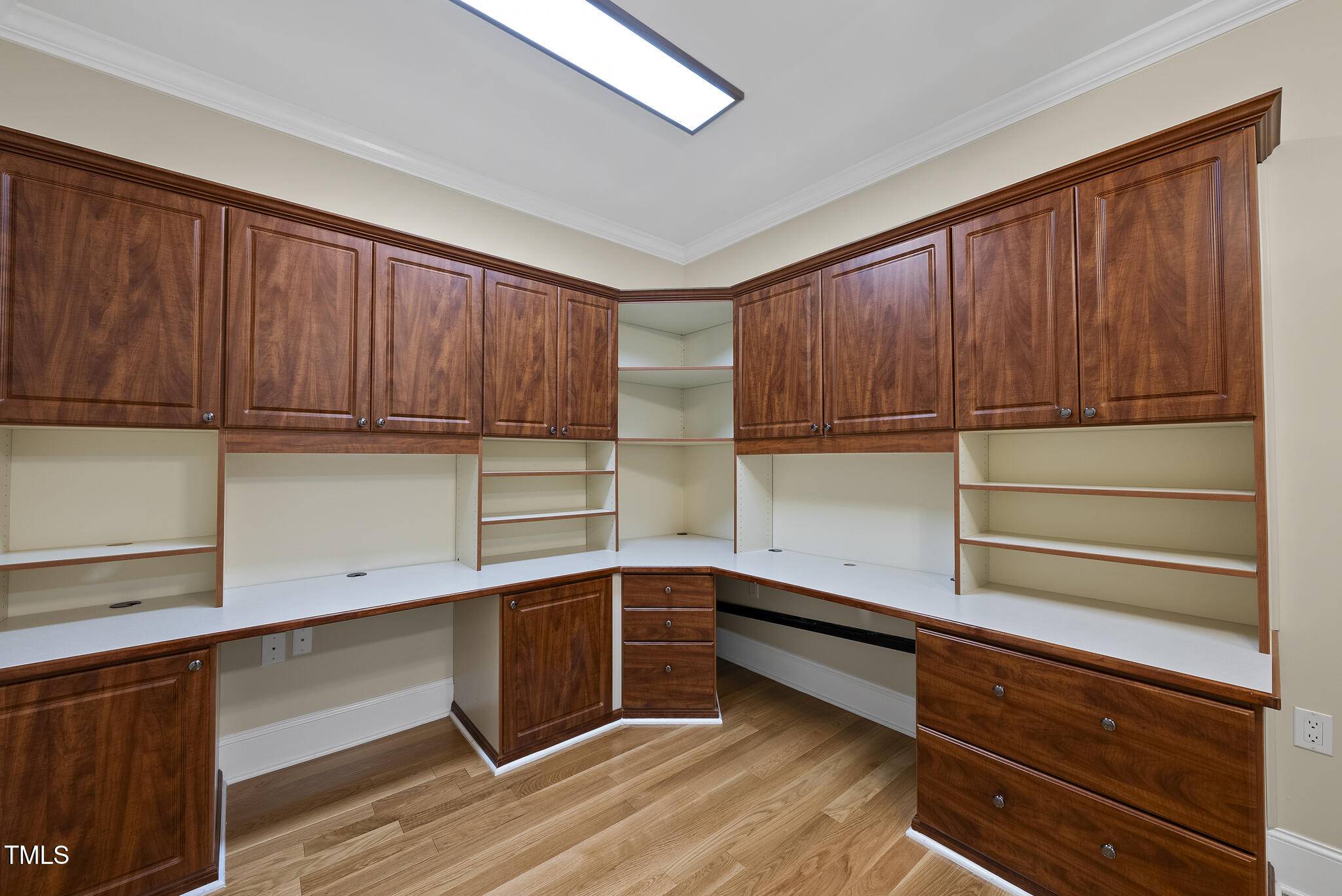3700 Baron Cooper Pass, Unit 302 Raleigh, NC 27612 - Photo 51 of 67 a kitchen with wooden cabinets and a sink