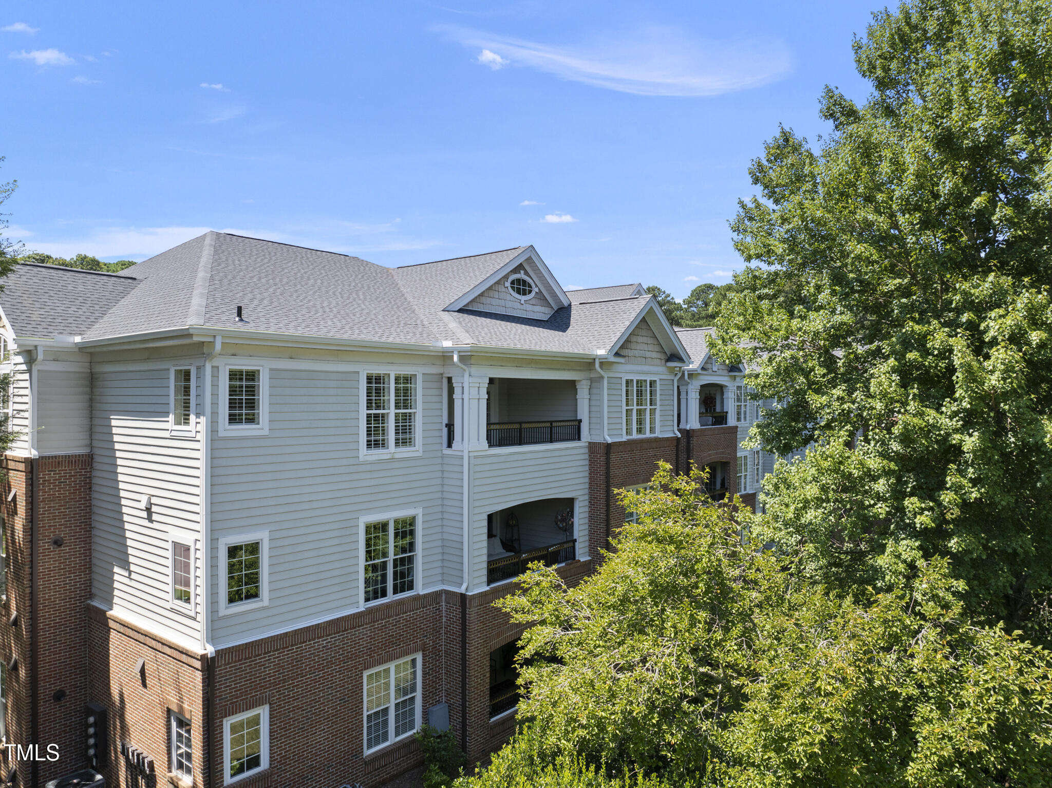 3700 Baron Cooper Pass, Unit 302 Raleigh, NC 27612 - Photo 56 of 67 a view of a house with a windows and a tree