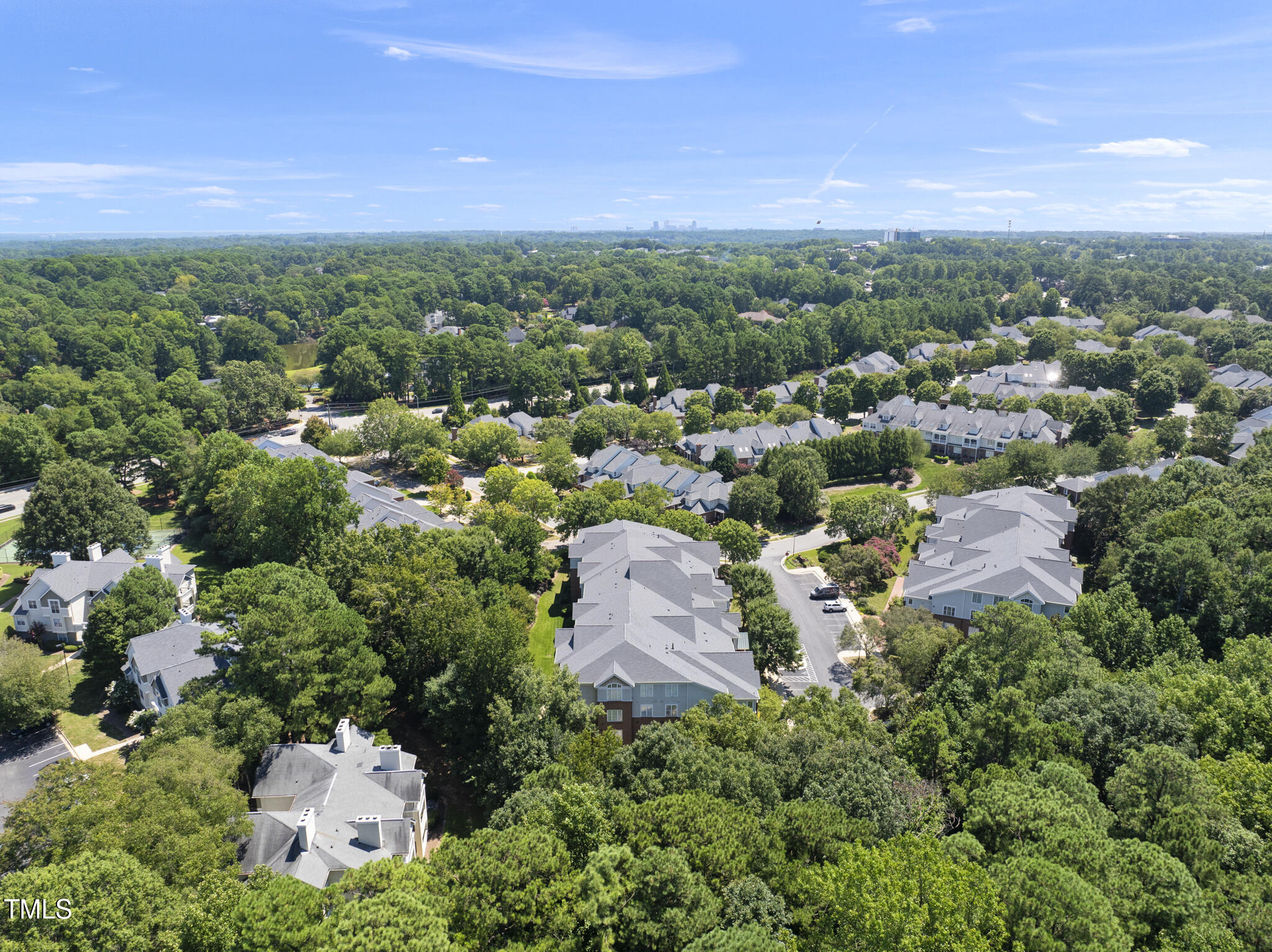 3700 Baron Cooper Pass, Unit 302 Raleigh, NC 27612 - Photo 60 of 67 an aerial view of a city with lots of residential buildings