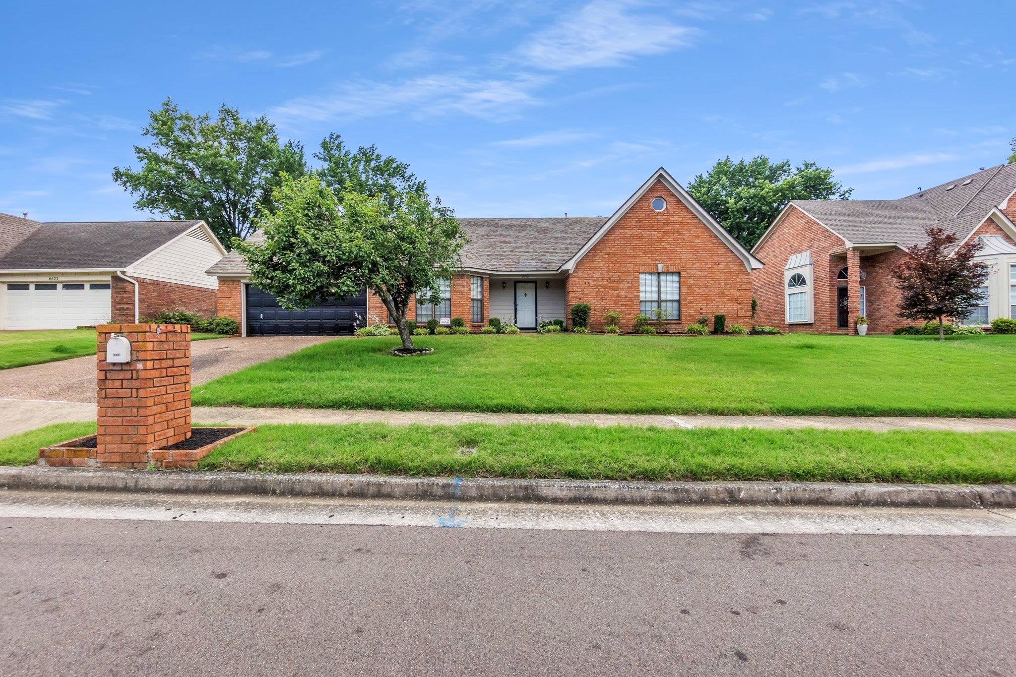 6613 Stephan Ridge Drive Bartlett, TN 38135 - Photo 1 of 24 Brick facade home with an attached two-car garage