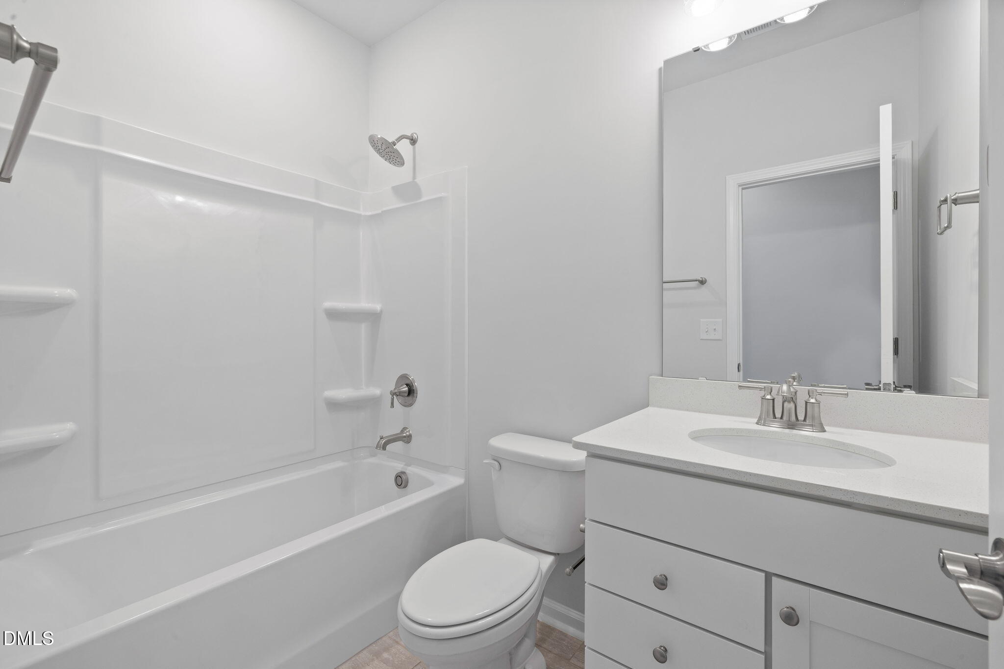 332 Broomside Avenue Raleigh, NC 27603 - Photo 18 of 32 a bathroom with a sink a toilet and shower