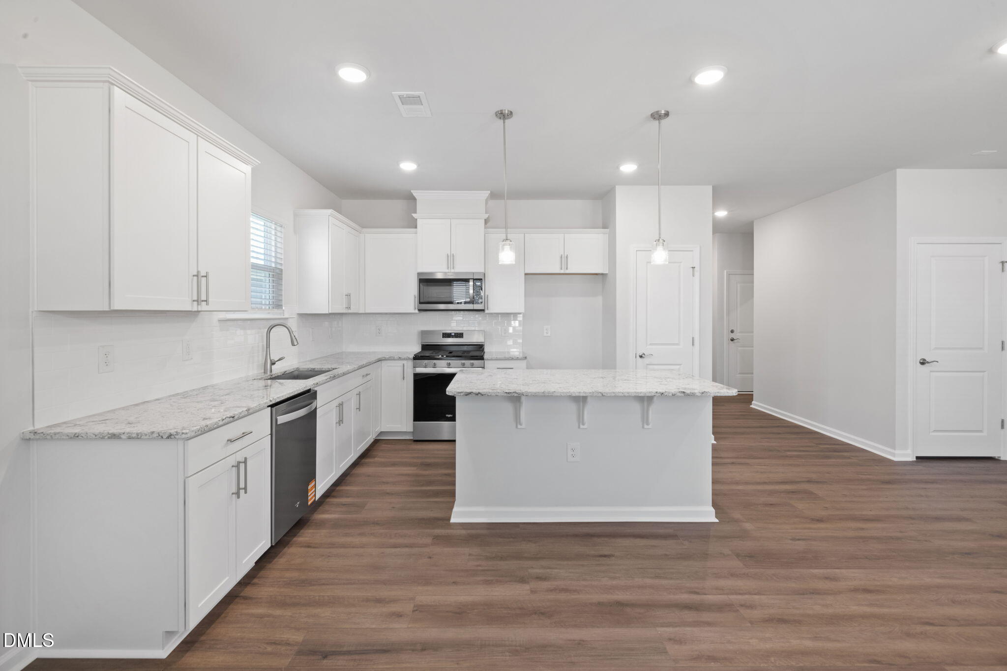 332 Broomside Avenue Raleigh, NC 27603 - Photo 2 of 32 a large kitchen with stainless steel appliances cabinets a sink and a stove top oven