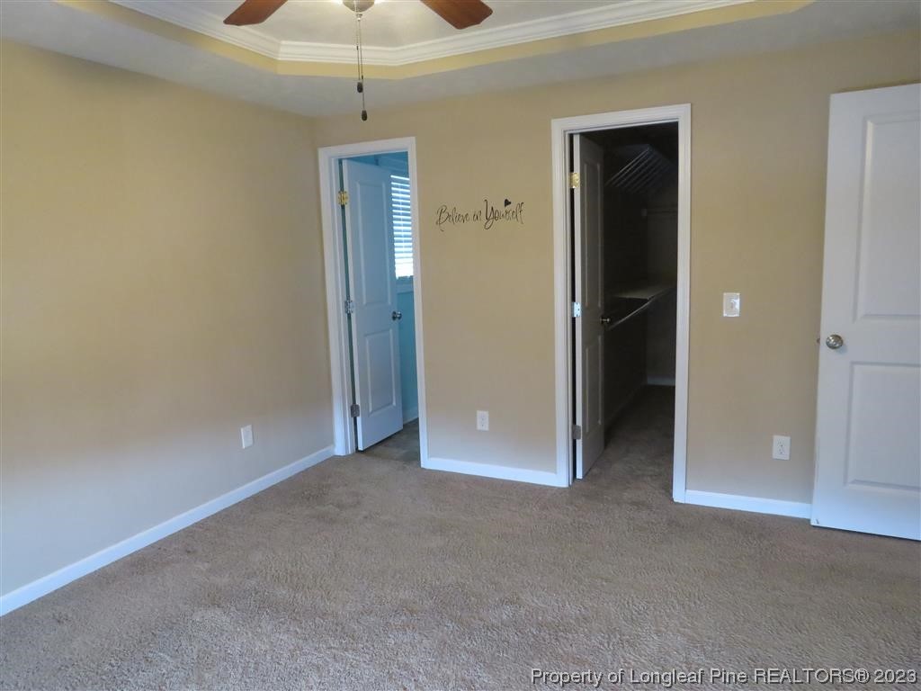 44 Archer Drive Bunnlevel, NC 28323 - Photo 7 of 10 an empty room with closet and a chandelier fan
