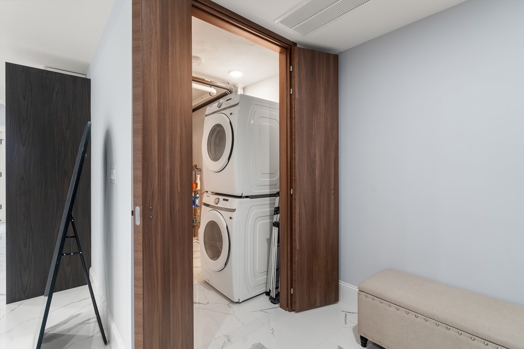 32 Pearl Street, Unit 4 Boston, MA 02125 - Photo 7 of 35 a utility room with dryer and washer