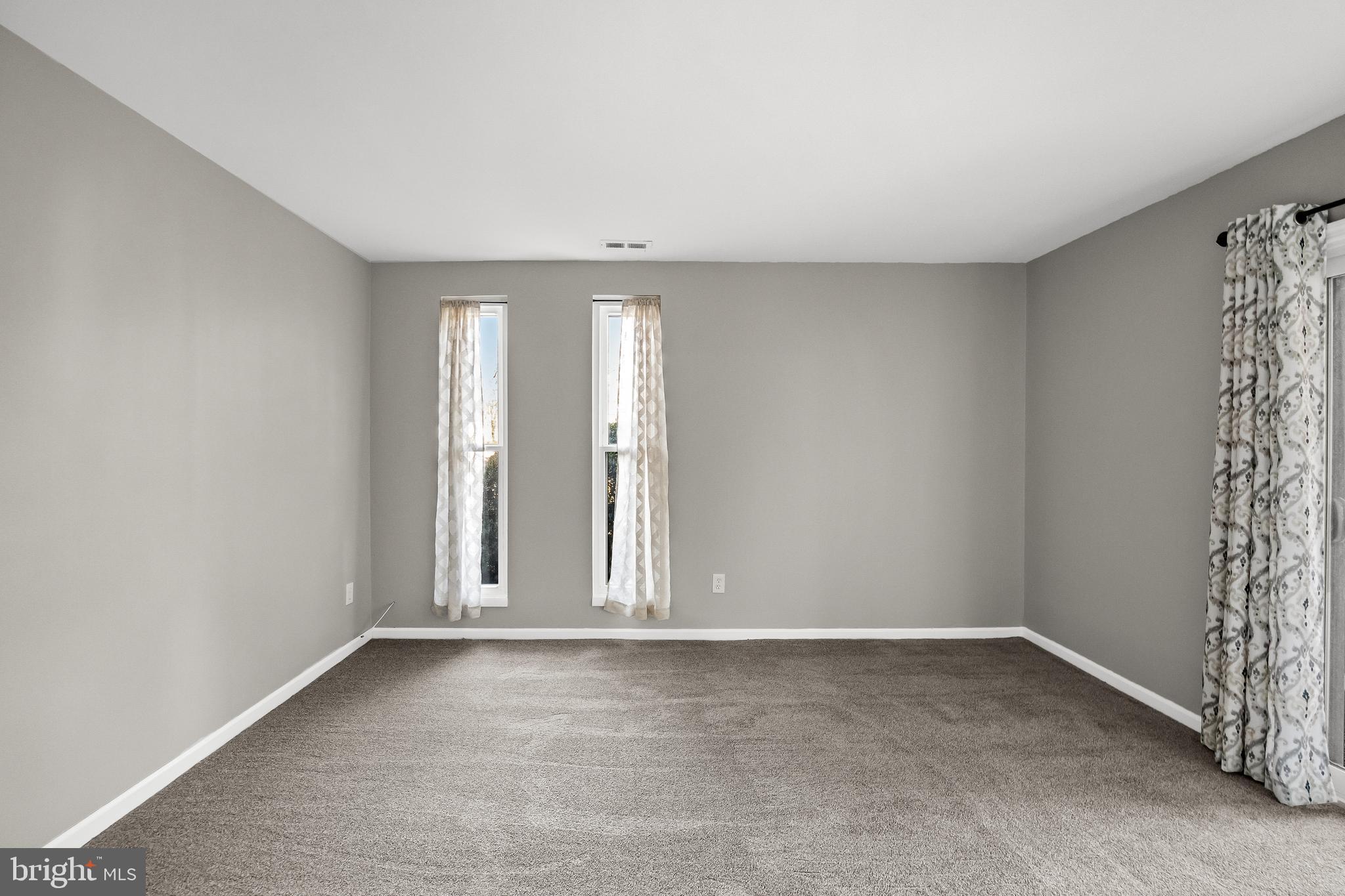 25 South Church Road, Unit 129 Maple Shade, NJ 08052 - Photo 20 of 24 an empty room with windows