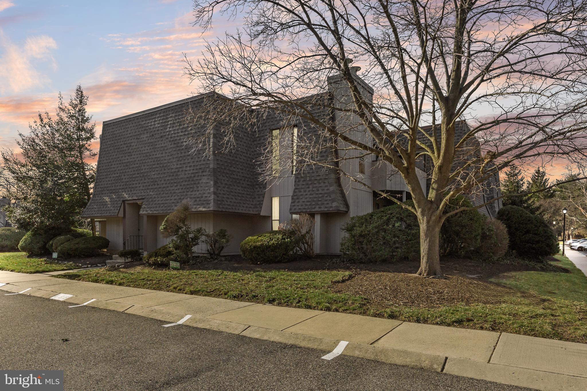 25 South Church Road, Unit 129 Maple Shade, NJ 08052 - Photo 22 of 24 a front view of house with yard and trees around
