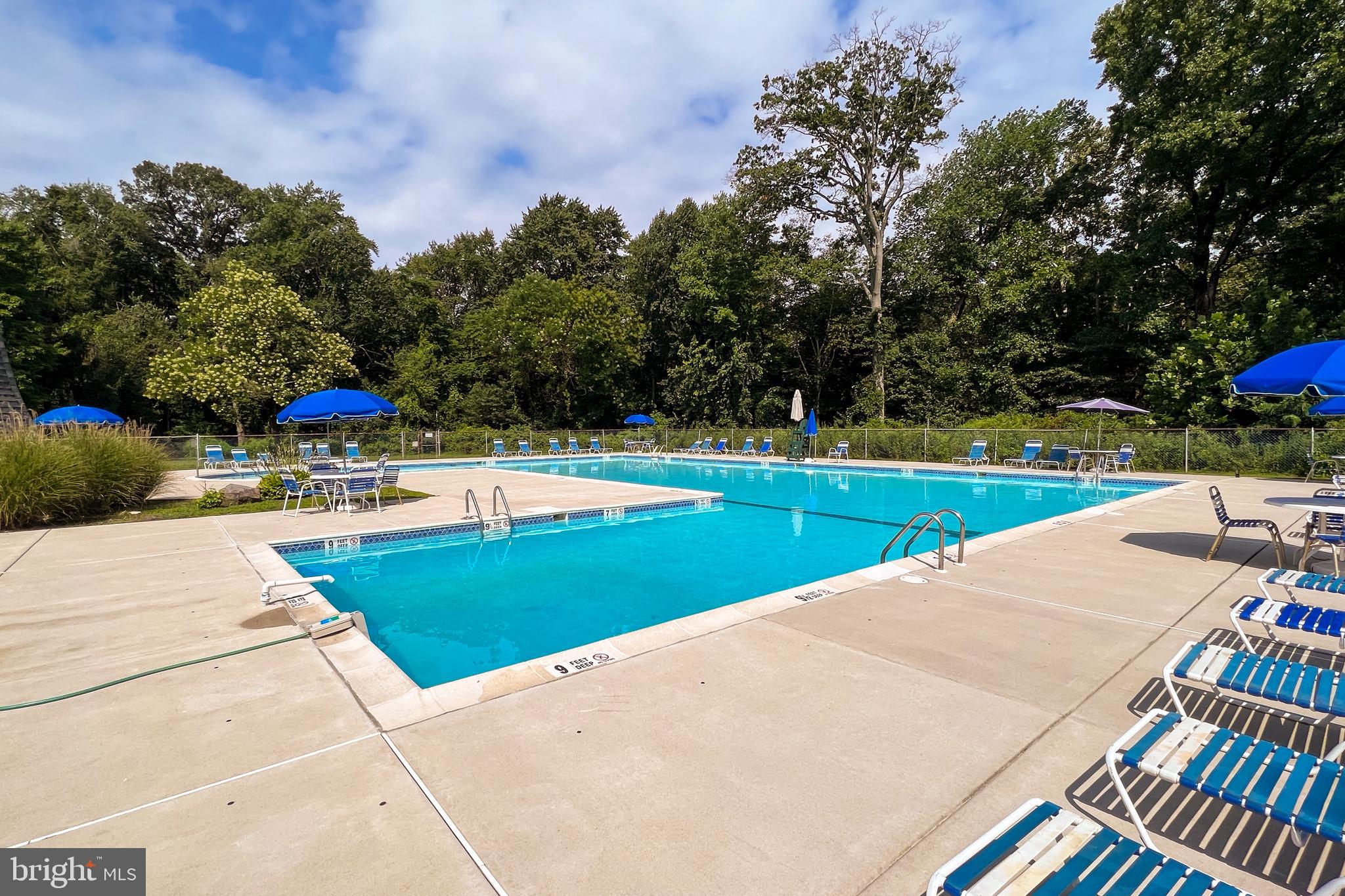 25 South Church Road, Unit 129 Maple Shade, NJ 08052 - Photo 23 of 24 a view of a swimming pool and lounge chairs