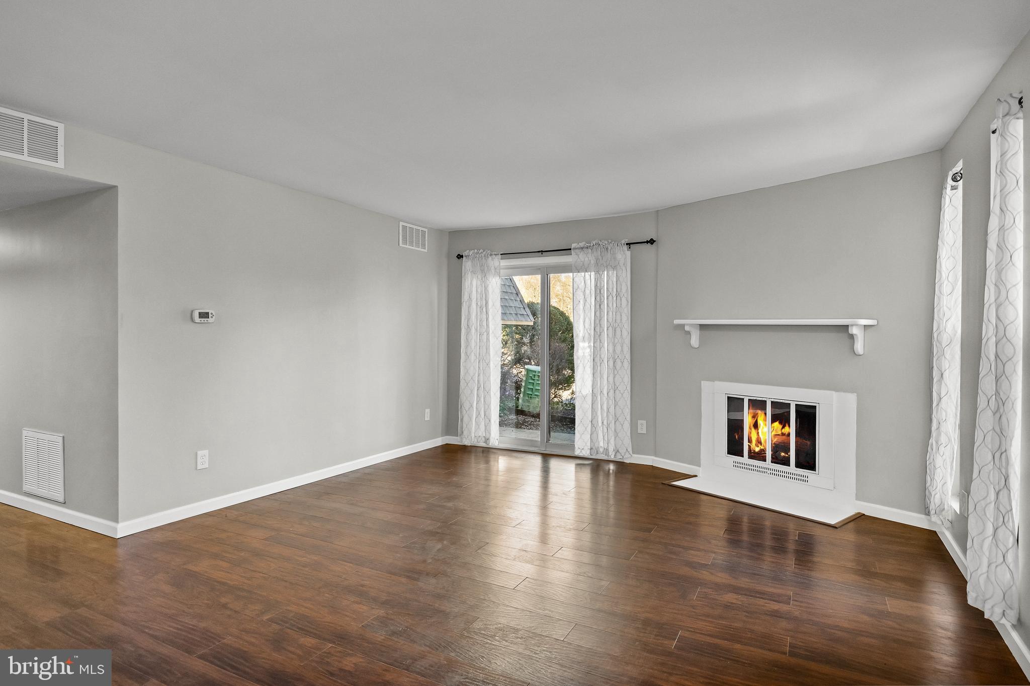 25 South Church Road, Unit 129 Maple Shade, NJ 08052 - Photo 4 of 24 an empty room with wooden floor and windows