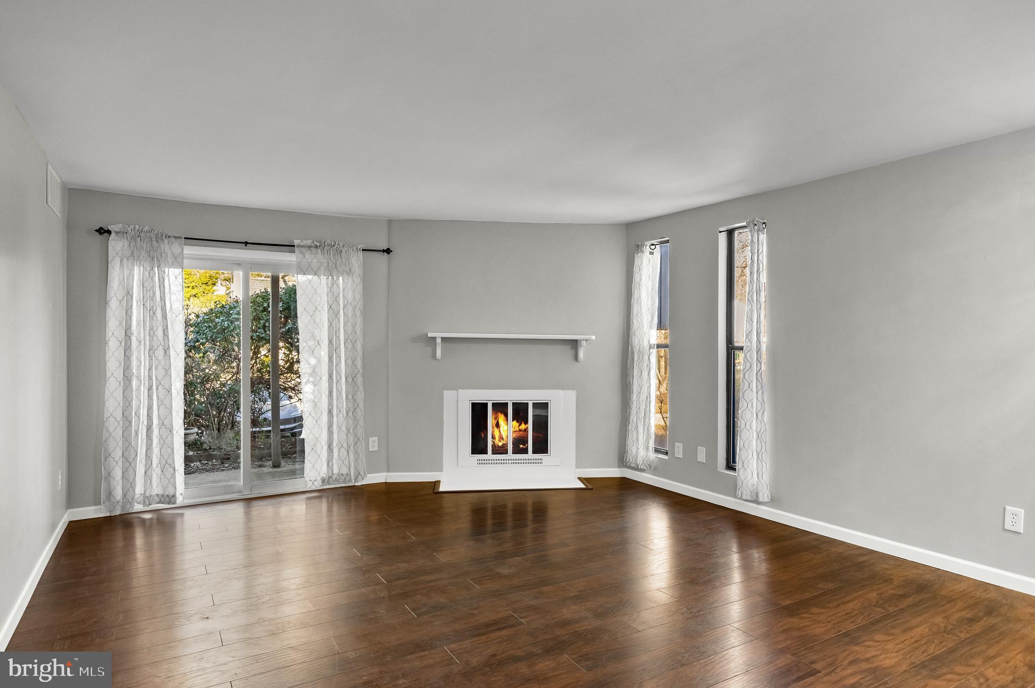 25 South Church Road, Unit 129 Maple Shade, NJ 08052 - Photo 5 of 24 an empty room with wooden floor and windows