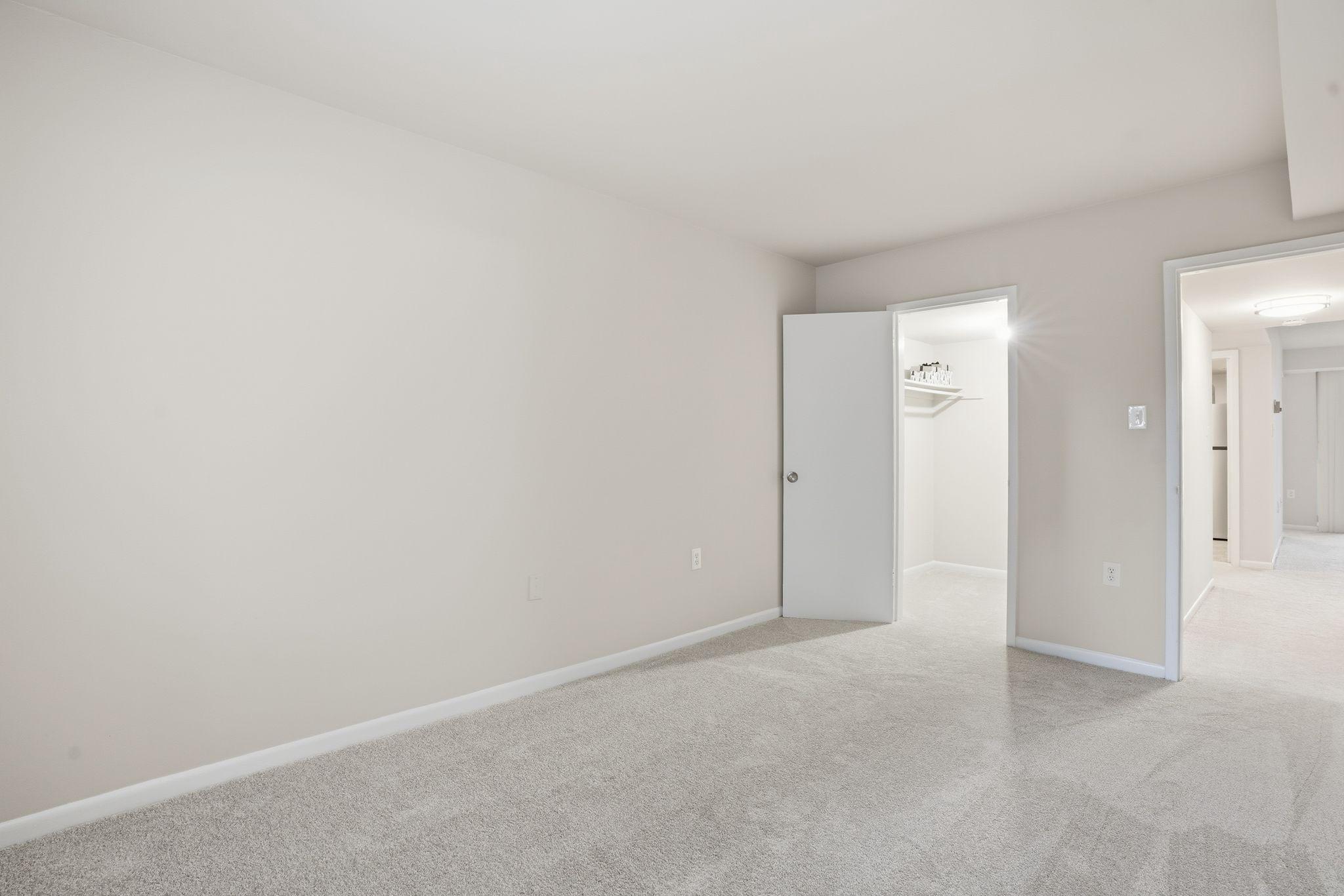 1552 Northgate Square, Unit 12B Reston, VA 20190 - Photo 20 of 29 Primary Bedroom and view of walk-in closet
