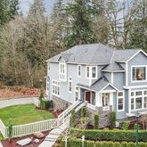 a aerial view of a house with a yard