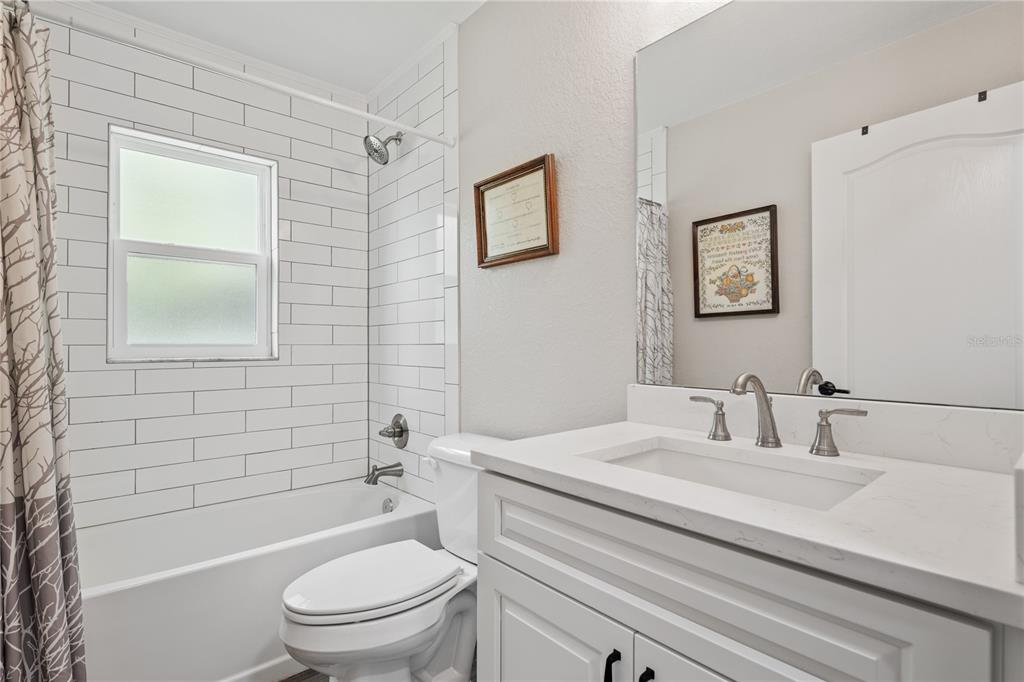 12929 Southwest 89th Street Dunnellon, FL 34432 - Photo 27 of 76 a bathroom with a sink a toilet and shower