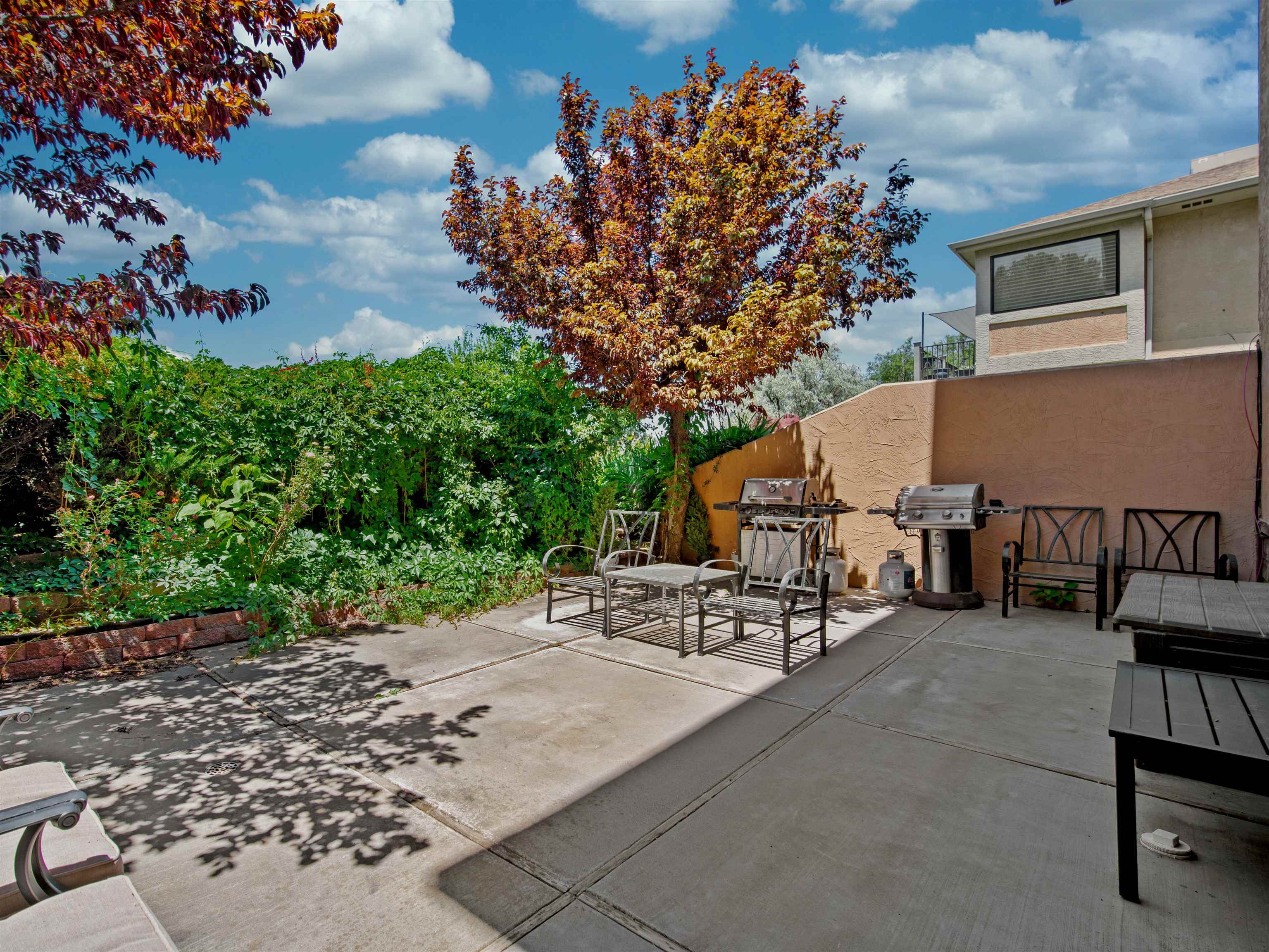 517 Rado Drive, Unit D Grand Junction, CO 81507 - Photo 19 of 24 a view of a terrace with chairs and potted plants