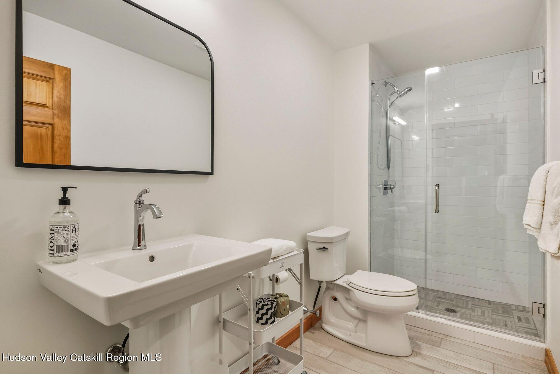 3 The Enclave Windham, NY 12496 - Photo 12 of 59 a bathroom with a sink toilet and shower