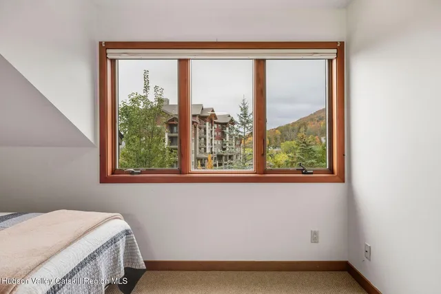 a bathroom with double sink and a mirror