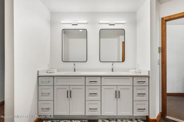 a bathroom with a shower and a sink