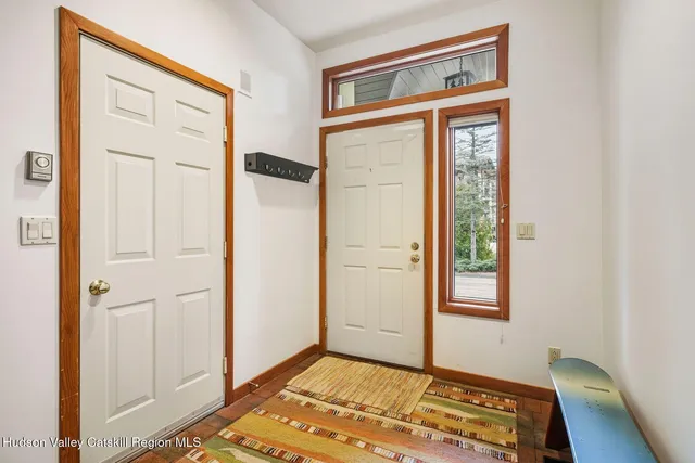 a view of entryway with wooden floor
