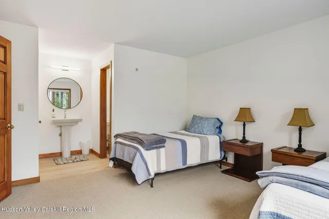 a bedroom with a bed and a tv