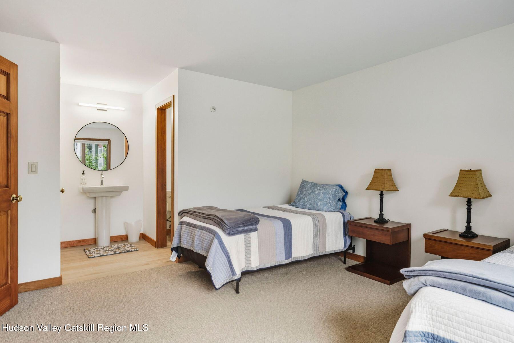 3 The Enclave Windham, NY 12496 - Photo 24 of 59 a spacious bedroom with a bed and window