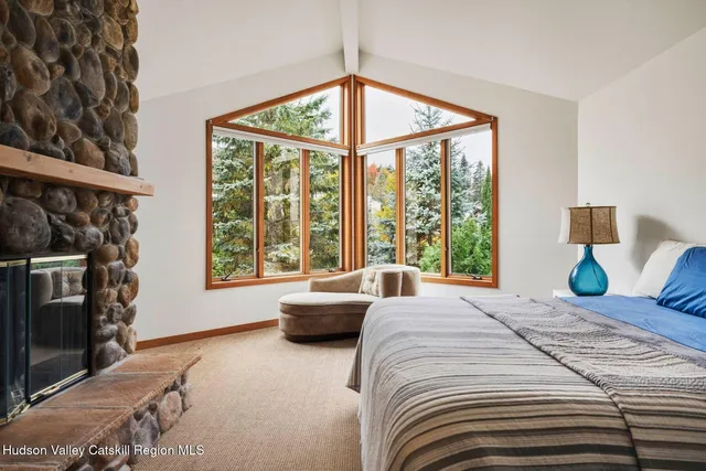 a bedroom with bed and window