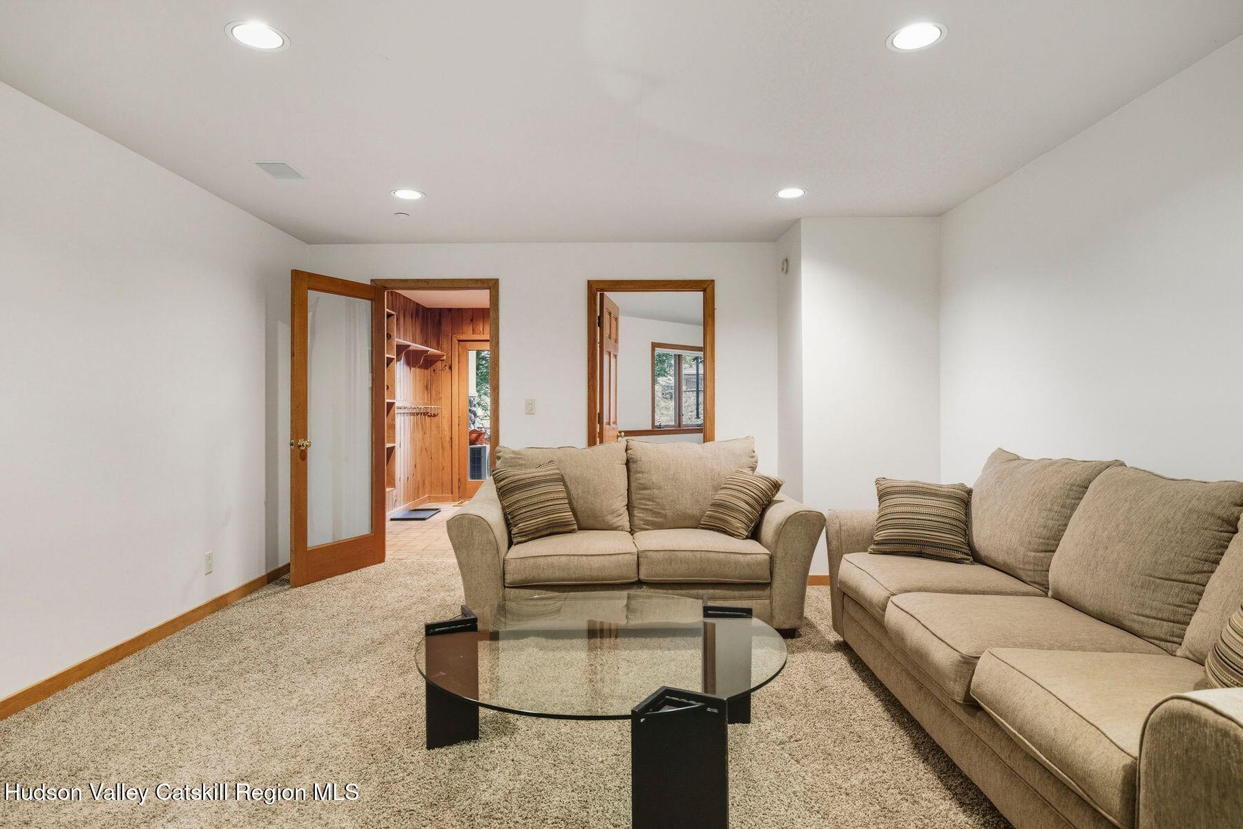 3 The Enclave Windham, NY 12496 - Photo 34 of 59 a living room with furniture and a couch