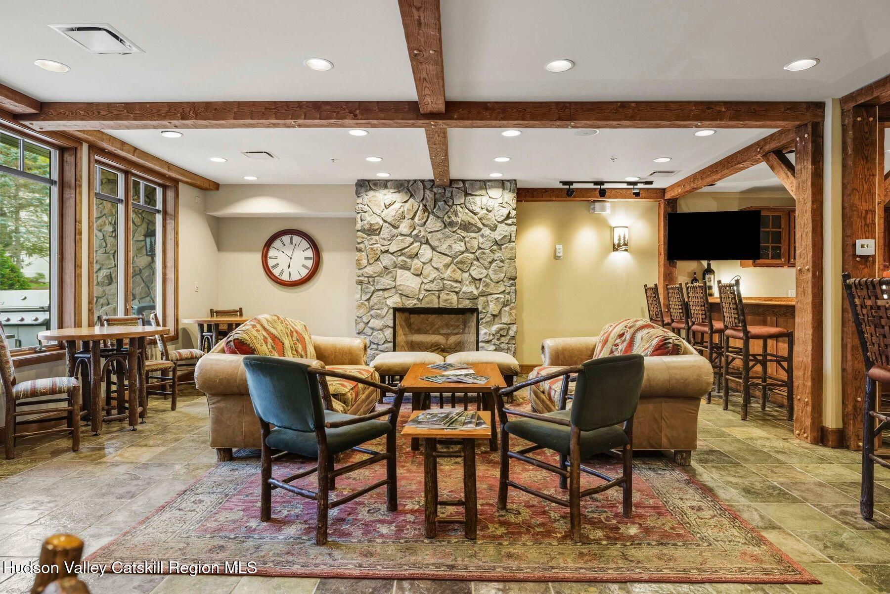 3 The Enclave Windham, NY 12496 - Photo 48 of 59 a dining room with furniture and a fireplace