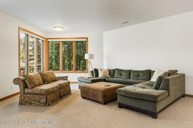 a view of balcony with wooden floor and outdoor seating