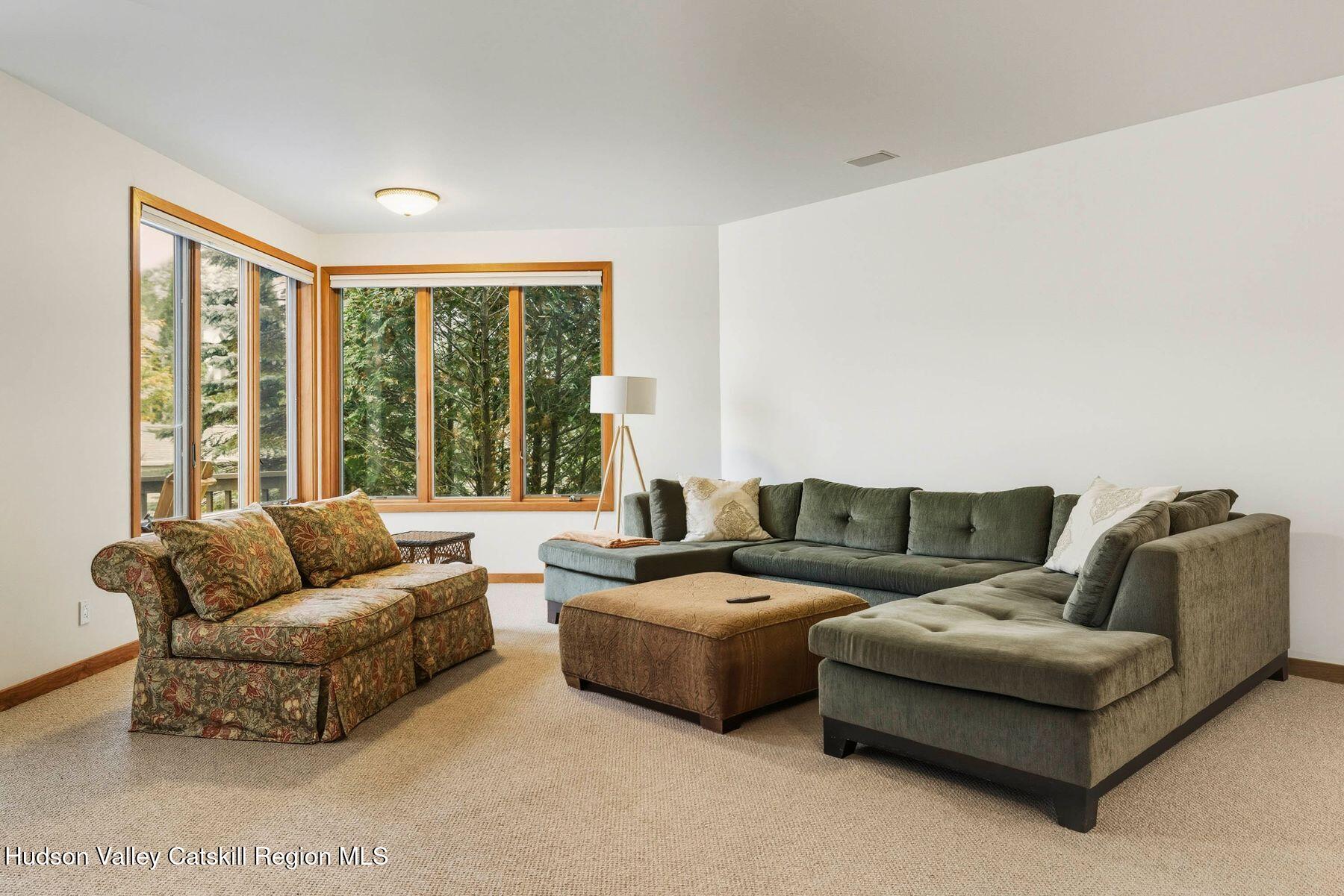 3 The Enclave Windham, NY 12496 - Photo 5 of 59 a living room with furniture and a large window